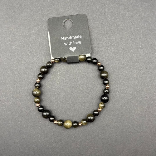 Handgefertigtes Armband aus gold schwarzen Perlen in unterschiedlichen Größen